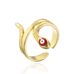 Detail of gold snake ring featuring red enamel eyes and adjustable open band design
