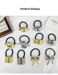 Close-up of gold and silver metal elastic hair ties in various geometric shapes