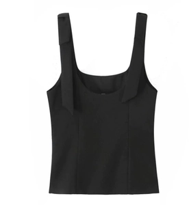 Detail of adjustable bow-tie shoulder straps on black sleeveless stretch top