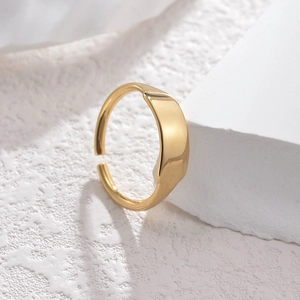 Minimalist 18K gold plated geometric open ring displayed on white textured stone