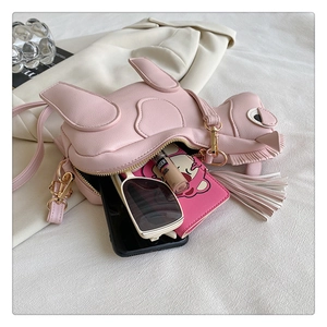 Pink PU leather horse crossbody bag showing capacity for phone, sunglasses and wallet