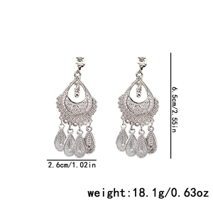 Ethnic style silver hollow filigree earrings with tassel teardrop detail and dimensions