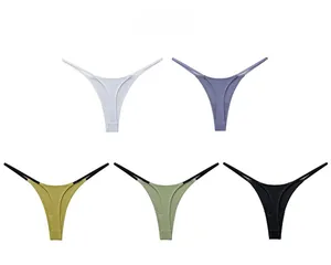 Flat lay of ribbed cotton G-strings in five colors including blue, yellow, and green