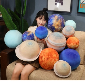 Detailed series of 3D planet plush pillows showing various sizes and planetary patterns