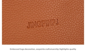 Close-up of orange-brown litchi pattern leather with embossed JINGPINPJ logo detail