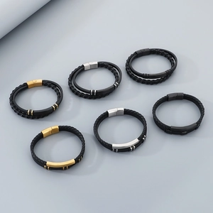 Detail of multi-layer braided leather bracelets with various magnetic metal clasps