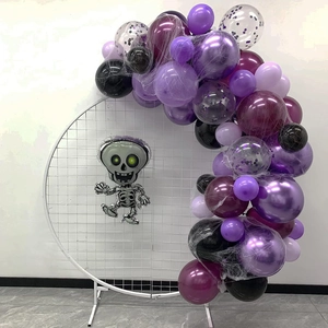 Detail of Halloween balloon arch with purple latex balloons and a skeleton foil balloon