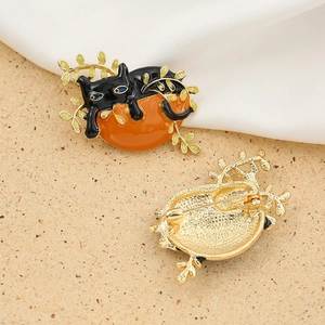Enamel black cat on pumpkin brooch pin with gold vines and safe metal needle clasp