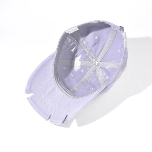Internal view of a distressed lavender cotton baseball cap with gray inner seam binding