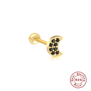 Macro view of gold moon stud earring with black gems and 925 sterling silver stamp