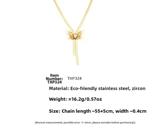 Detailed view of golden butterfly necklace with marquise zircon on flat snake chain