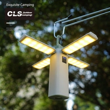 Detail of a portable four-leaf foldable LED camping light with light green ABS casing