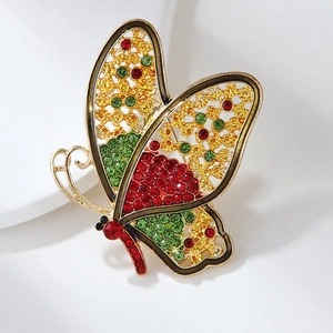Luxury butterfly brooch featuring multi-colored crystals set in a golden hollow metal frame