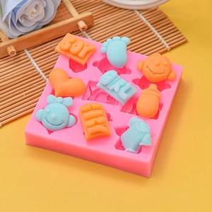 Pink silicone baby mold featuring hearts, bottles and tiny feet for DIY fondant projects
