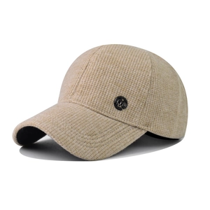 Detail of knit baseball cap with black metal M logo and contrast brim for autumn