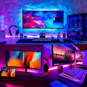 Macro detail of dynamic RGB LED light strip creating ambient gaming desk backlighting