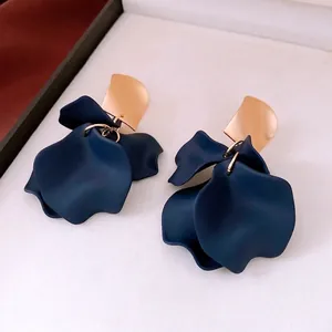 Navy blue acrylic petal drop earrings with gold metal studs and matte finish texture