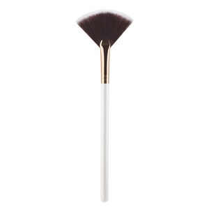 Large fan shaped makeup brush with white handle and rose gold ferrule for face highlighting
