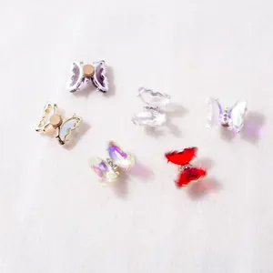 Rotating 3D crystal butterfly nail art charms with colorful spinning wings in various colors