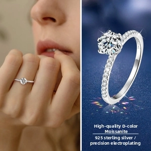 Macro shot of D color Moissanite ring with six-prong setting and 925 sterling silver band