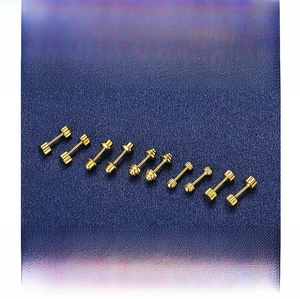 Macro detail of various gold-plated S925 sterling silver screw-back stud earrings