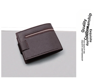 Close-up of a brown leather wallet with textured litchi grain and a metal zipper pocket