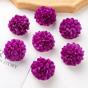 Close-up of seven dark purple artificial silk pompom mum flower heads for DIY crafts