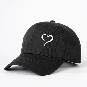 Classic black cotton baseball cap with white heart print and adjustable back strap