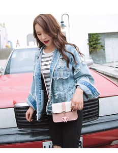 Pink and white patchwork PU leather crossbody bag with heart pendant detail