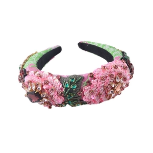 Ornate sponge headband with sequin flowers and crystal rhinestone leaf embellishments