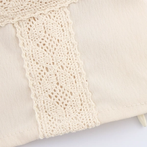Beige lace patchwork camisole top showing detailed fabric texture and zipper detail