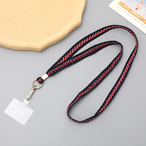 Detail of woven fabric crossbody phone strap with durable metal hook and clear insert tab