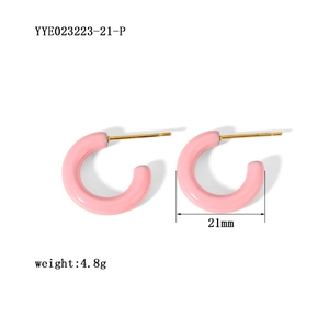 Detail view of pink C-shaped earrings showing 21mm diameter and 4.8g weight