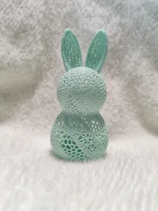 Detailed macro view of 3D printed mint green Easter rabbit lamp with lattice hollow structure
