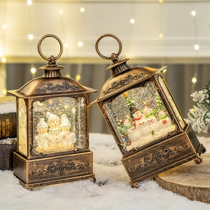 Vintage bronze Christmas lantern with snowman scene and warm glowing LED lights