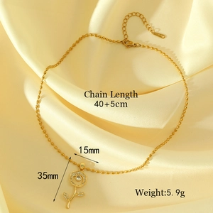 Elegant gold rose pendant necklace with sparkling zircon inlay on yellow silk fabric