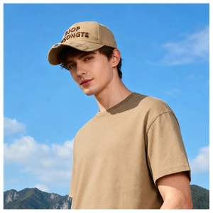 Close-up of khaki baseball cap with DJOP SONGTE embroidery and distressed detailing