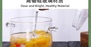 Close-up of high borosilicate glass pot with lid and fruit pieces inside for healthy cooking