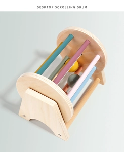 Macro detail of the wooden desktop scrolling drum with colorful bars for early education
