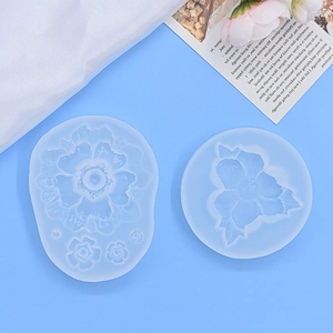Two-piece floral silicone mold set for chocolate mousse and candle making on blue background