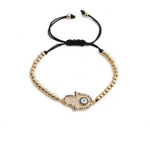 Bracelet tressé Main de Fatma avec perles dorées et pierres en zircon étincelantes
