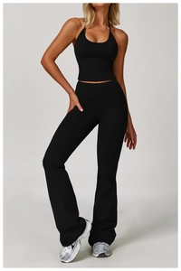 Detailed view of black halter yoga set featuring high-waisted flared workout pants