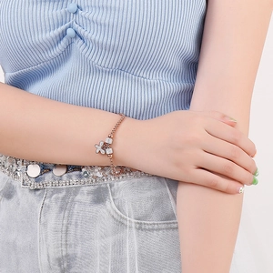 Elegant rose gold pearl bracelet for women featuring crystal butterfly bow and magnetic clasp