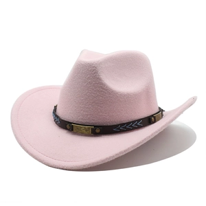 Detail of pink felt cowboy hat with brown leather band, gold studs and arrow embroidery