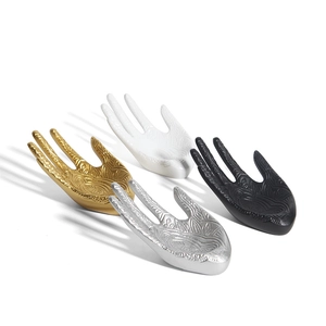Mandala engraved hand-shaped jewelry display stand in gold, white, black and silver