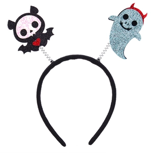 Detail of Halloween headband featuring a spring-mounted black bat and glittery blue ghost