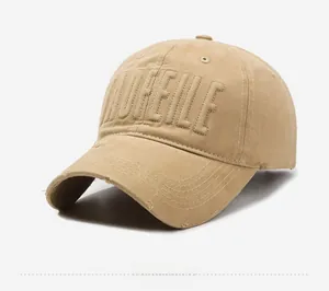 Detail of vintage khaki baseball cap with 3D MOFEILE embroidery and distressed fabric texture