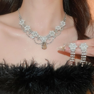 Elegant floral necklace and earrings set with water drop pearls and sparkling rhinestones