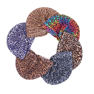 Multiple colorful leopard print headscarves and turbans for women in various shades