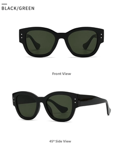 Detail view of oval marble pattern sunglasses with black frames and green lenses